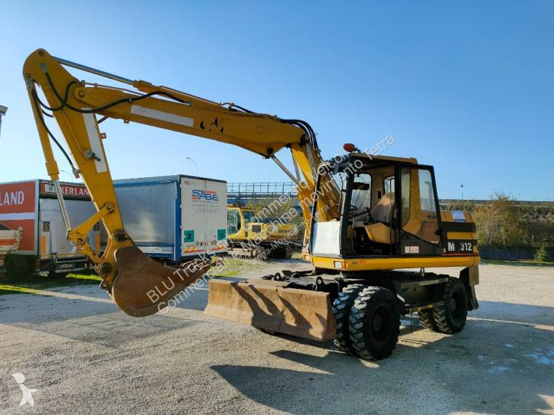 Escavatore gommato Caterpillar M312 Escavatore Gommato cat 312 M con benna e martello usato 1997 - 116 CV - 3200 heures - Ref. 8049692