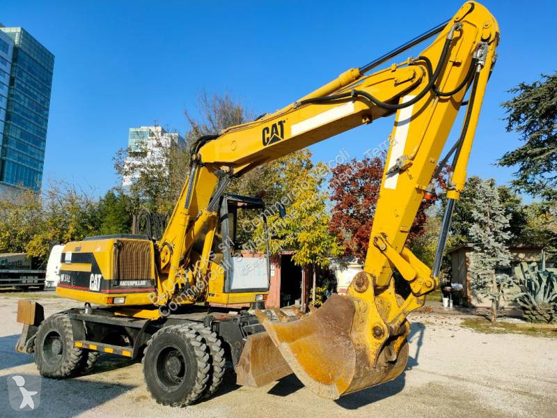 Escavatore gommato Caterpillar M312 Escavatore Gommato cat 312 M con benna e martello usato 1997 - 116 CV - 3200 heures - Ref. 8049692 - Photo 2